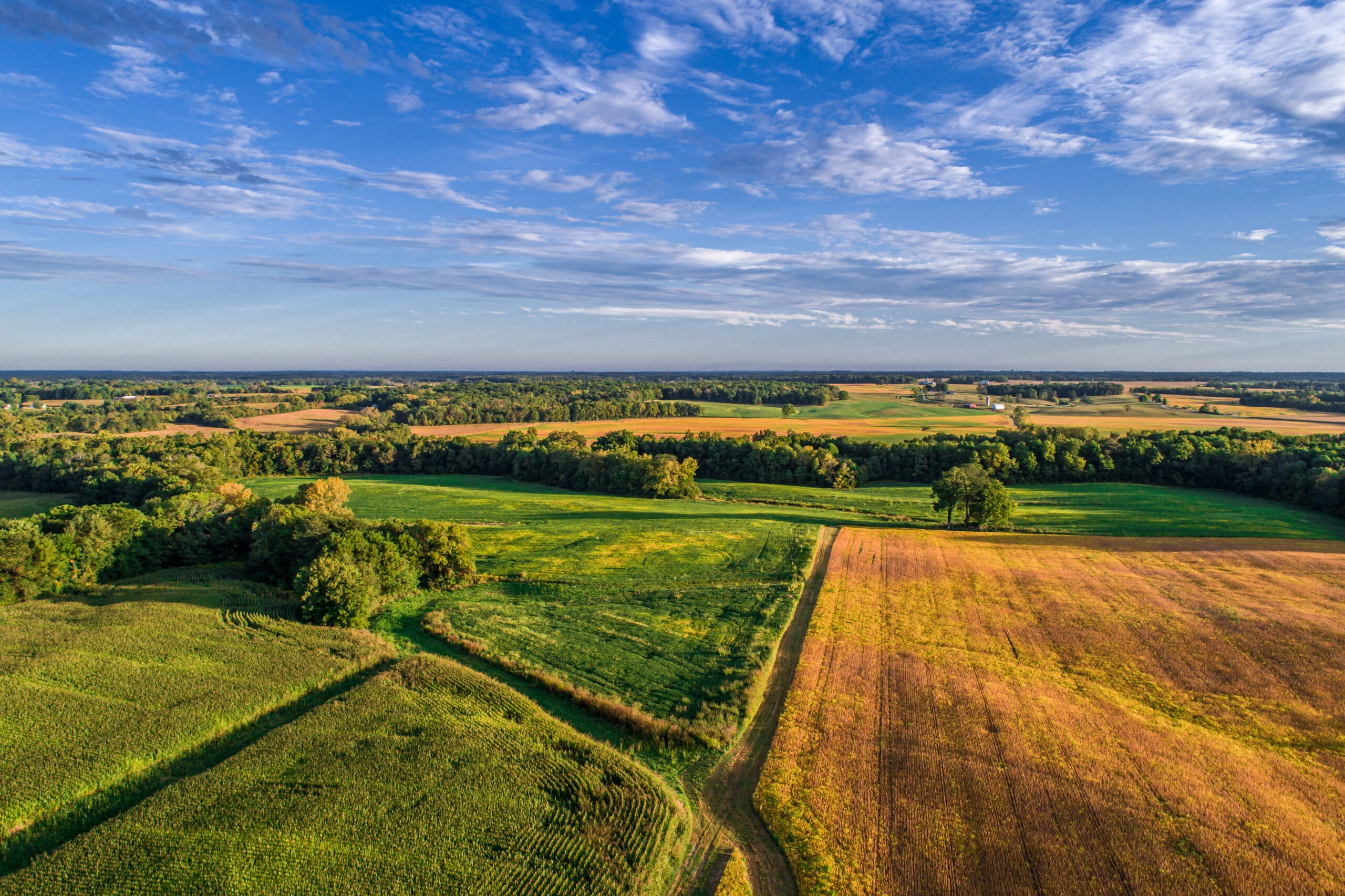 Survey drone mapping a large parcel of land from above