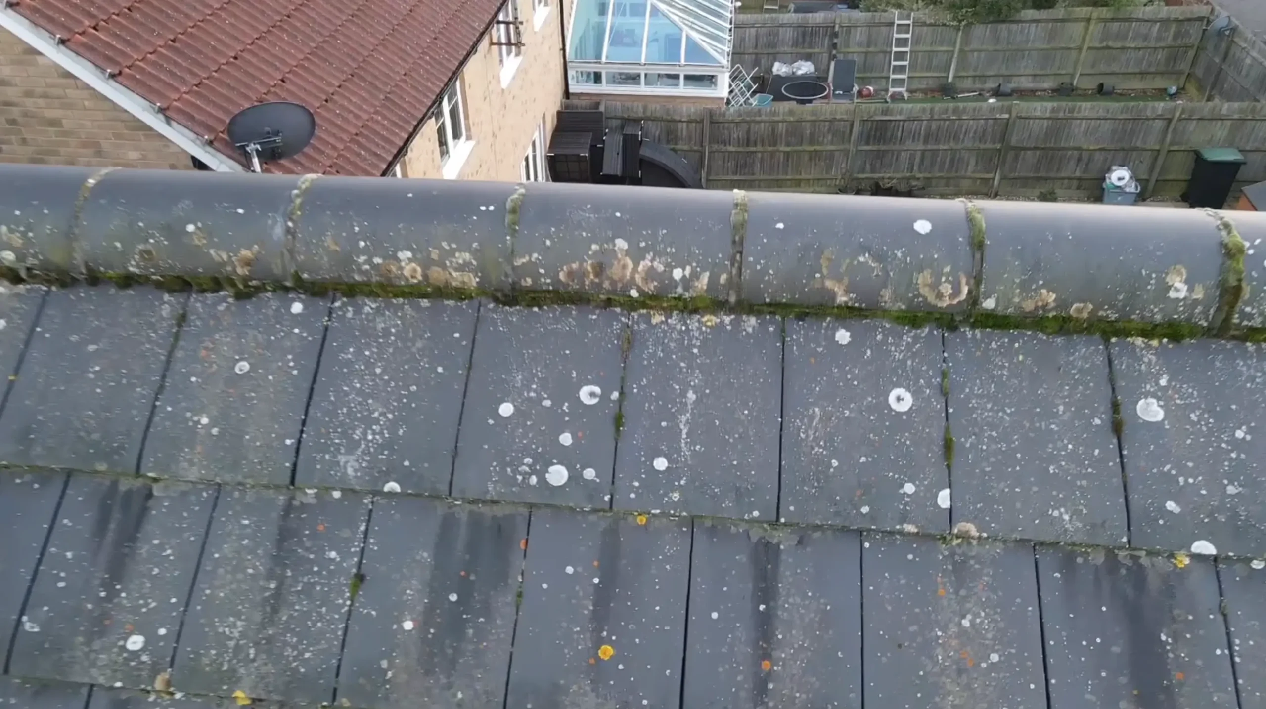 High-resolution drone imagery of a tiled roof ridge and detail