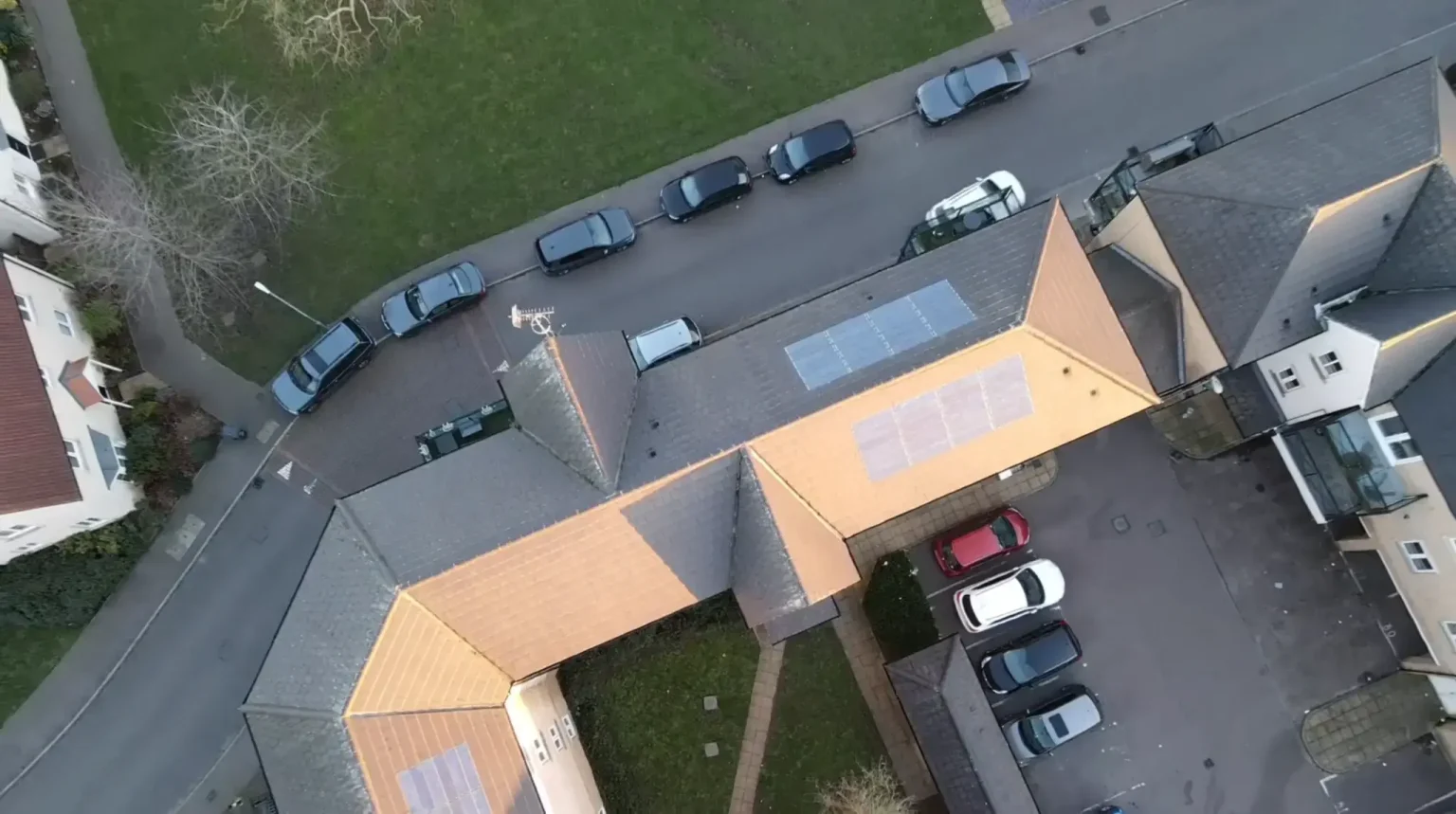 Drone operator flying a building facade survey from the ground